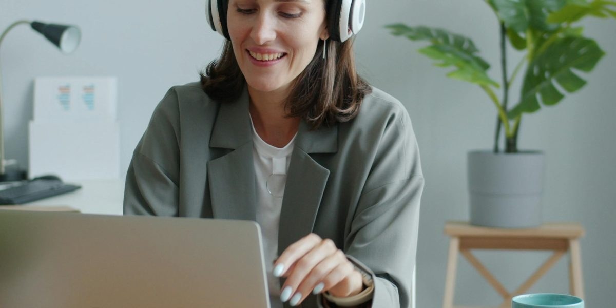 High-ticket closer speaking on a headset during a video sales call