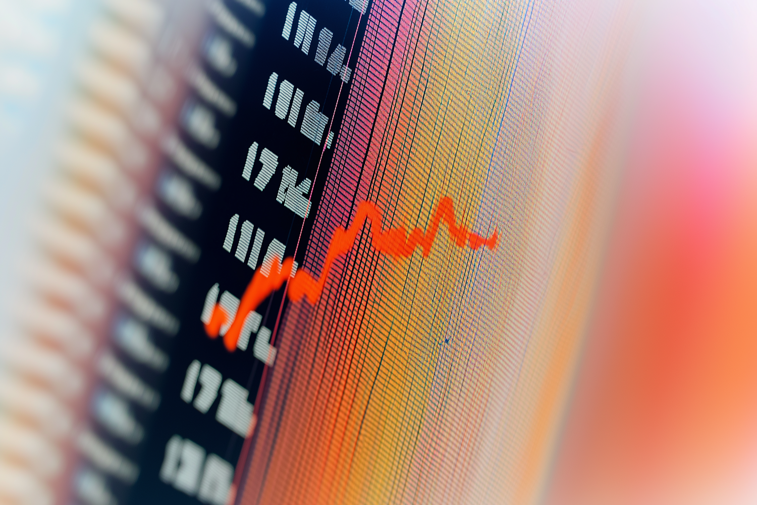 An individual thoughtfully examining various data points, representing the process of identifying high-potential products and trends from market signals.